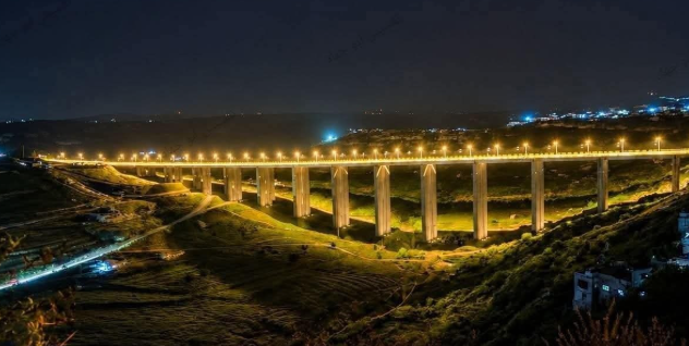 Al-Rastan bridge lit at night